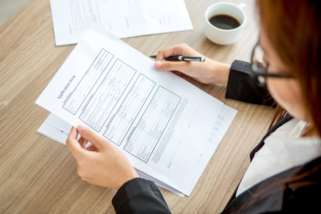 Young Businesswoman Reading Application Form 1024x683